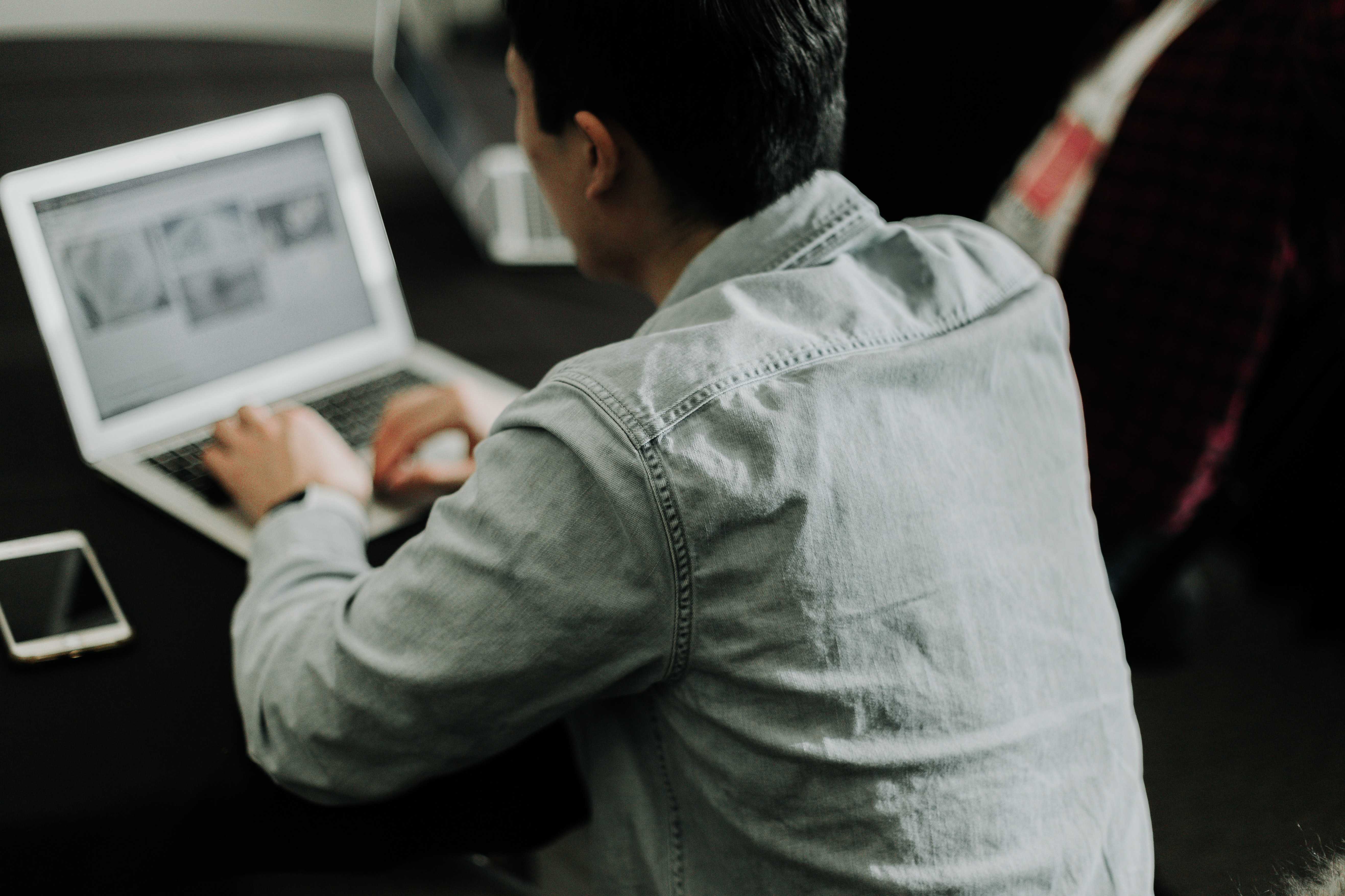 A person working at their laptop